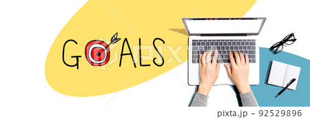Goal concept with person using a laptop Goal concept with person using a laptop 92529896