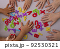 Kids learning alphabet letters. Top view, education concept 92530321
