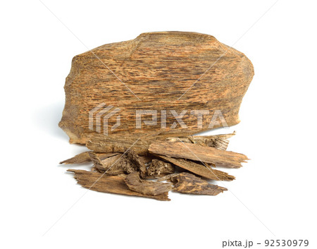 Agarwood, aloeswood, eaglewood or gharuwood. Piece of wood and shavings. Isolated. Agarwood, aloeswood, eaglewood or gharuwood. Piece of wood and shavings. Isolated. 92530979