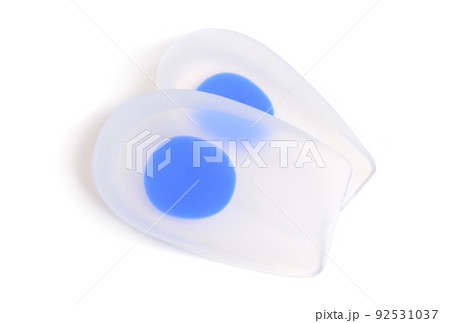A pair of orthopedic silicone insoles isolated on white. A pair of orthopedic silicone insoles isolated on white. 92531037