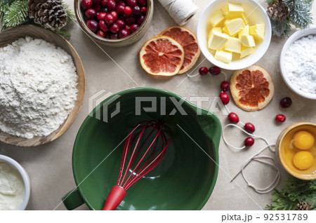 Cooking Christmas cookies. Top view of empty bowl and baking ingredients eggs, flour, butter. Step by step recipe. 92531789