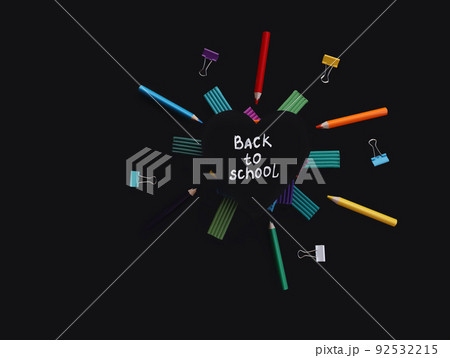 heart shaped board with back to school inscription and multicolored plasticine stacked on top of each other, pencils paper clips on black background heart shaped board with back to school inscription and multicolored plasticine stacked on top of each other, pencils paper clips on black background 92532215