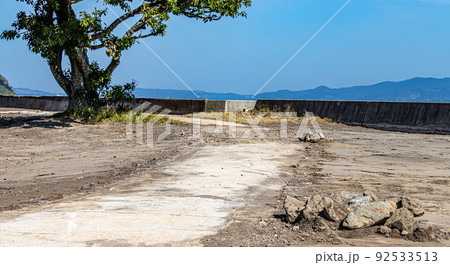 After a cleanup, small rocks are left behind along a newly freed up, but old path. After a cleanup, small rocks are left behind along a newly freed up, but old path. 92533513