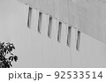 6 small windows bring light into a large building. 6 small windows bring light into a large building. 92533514