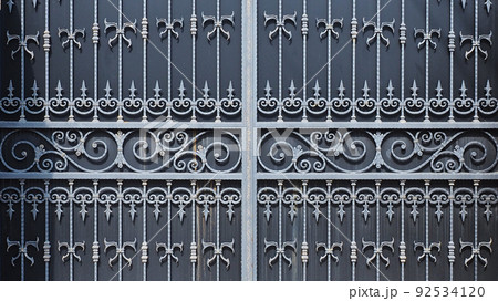 Forged patterned lattice on the gate of the house. Lattice with monograms and spades on a massive gate. Biting business. Production of iron decor. Full screen photo Forged patterned lattice on the gate of the house. Lattice with monograms and spades on a massive gate. Biting business. Production of iron decor. Full screen photo 92534120