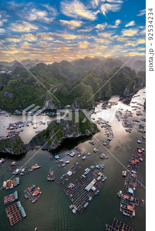 Floating fishing village and rock island in " Lan Ha " Bay, Vietnam, Southeast Asia 92534234