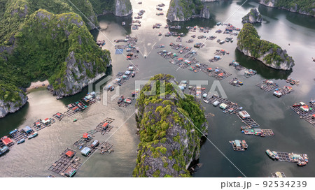 Floating fishing village and rock island in " Lan Ha " Bay, Vietnam, Southeast Asia 92534239