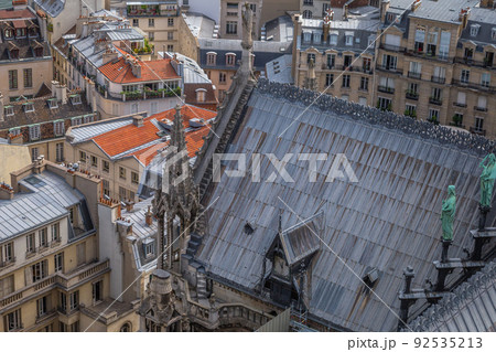Notre Dame Cathedral of Paris spire from above with statues, France 92535213