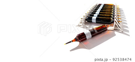 Group of ampoules with a transparent medicine in medical laboratory. lot of ampoules on light background. banner with copy space 92538474