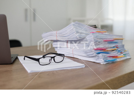 Business Documents concept  document achieves on folders papers at busy work desk office 92540283
