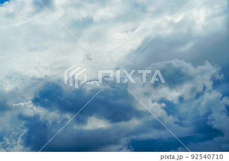 blue sky and sun behind clouds on daytime blue sky and sun behind clouds on daytime 92540710