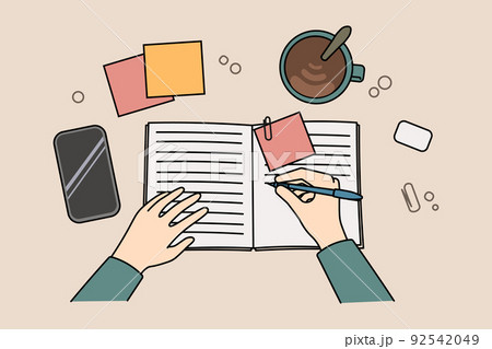 Peron making notes in notebook  92542049