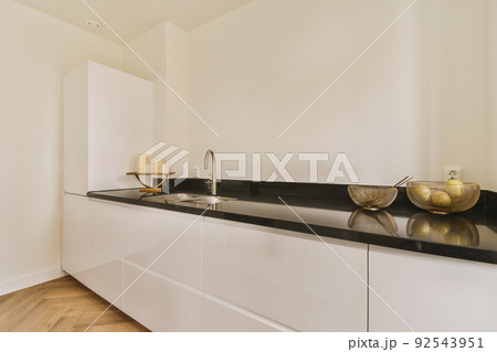 Interior of a beautiful kitchen of an elite house Interior of a beautiful kitchen of an elite house 92543951