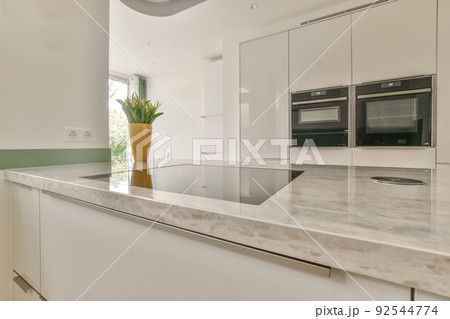 Interior of a beautiful kitchen of an elite house Interior of a beautiful kitchen of an elite house 92544774