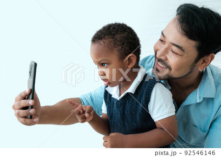 Daddy and son enjoy using times together Daddy and son enjoy using times together 92546146