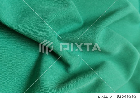 Green galliano fabric crumpled or wavy fabric texture background. Abstract linen cloth soft waves. Viscose yarn. Smooth elegant luxury cloth texture. Concept for banner or advertisement. 92546565