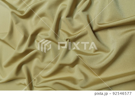 Gold supplex crumpled or wavy fabric texture background. Abstract linen cloth soft waves. Silk fabric. Smooth elegant luxury cloth texture. Concept for banner or advertisement. Gold supplex crumpled or wavy fabric texture background. Abstract linen cloth soft waves. Silk fabric. Smooth elegant luxury cloth texture. Concept for banner or advertisement. 92546577