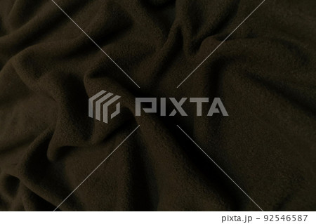 Brown fleece crumpled or wavy fabric texture background. Abstract linen cloth soft waves. Wool fabric. Smooth elegant luxury cloth texture. Concept for banner or advertisement. Brown fleece crumpled or wavy fabric texture background. Abstract linen cloth soft waves. Wool fabric. Smooth elegant luxury cloth texture. Concept for banner or advertisement. 92546587