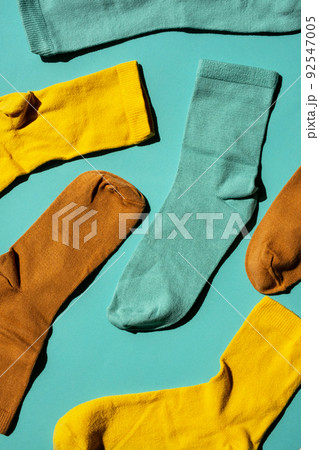 Some socks on turquoise background. Layout colourful socks. Some socks on turquoise background. Layout colourful socks. 92547005