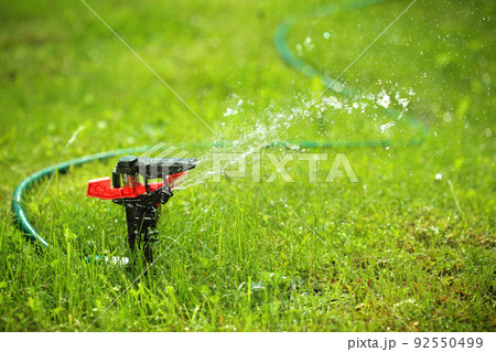 closeup of lawn sprinkler with copyspace closeup of lawn sprinkler with copyspace 92550499