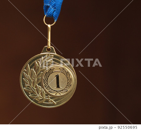 gold medal on brown background gold medal on brown background 92550695