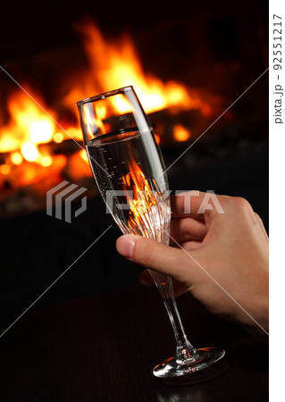 hand holding a glass with champagne hand holding a glass with champagne 92551217