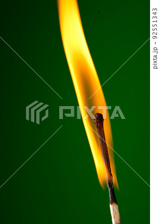 burning match on green 92551343