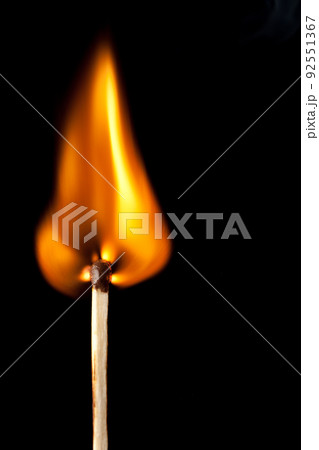 igniting match with tongue of flame on black igniting match with tongue of flame on black 92551367
