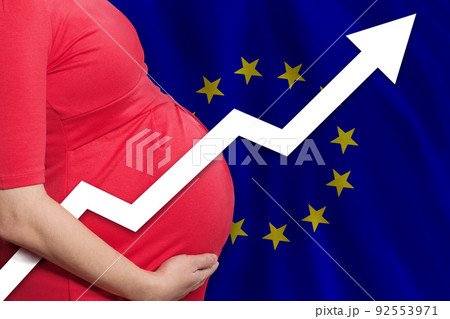 EU pregnant woman on flag of European Union background. Birth rate up 92553971
