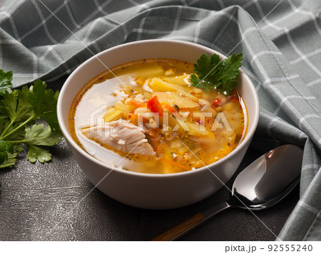 rassolnik with chicken - traditional Russian soup with pearl barley and pickles 92555240