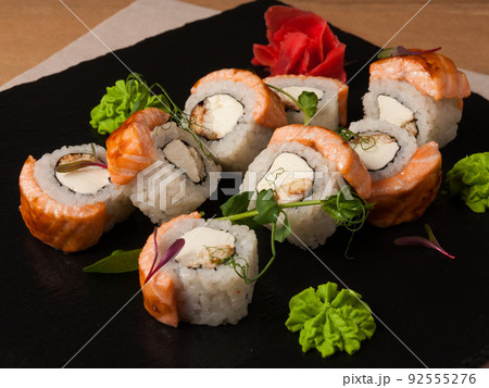 sushi rolls with baked salmon and eel 92555276