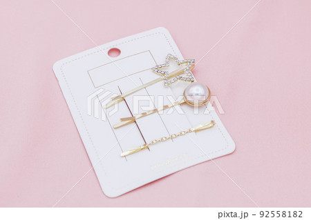 Luxury hair clips on pink background. Luxury hair clips on pink background. 92558182