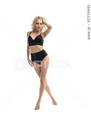 pretty blonde woman in black underwear walk in studio isolated pretty blonde woman in black underwear walk in studio isolated 92559491