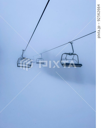 Ski Lift snowy mountain winter forest with chair lift At The Ski Resort in winter. Snowy weather Ski holidays Winter sport and outdoor activities Outdoor tourism Ski Lift snowy mountain winter forest with chair lift At The Ski Resort in winter. Snowy weather Ski holidays Winter sport and outdoor activities Outdoor tourism 92562664