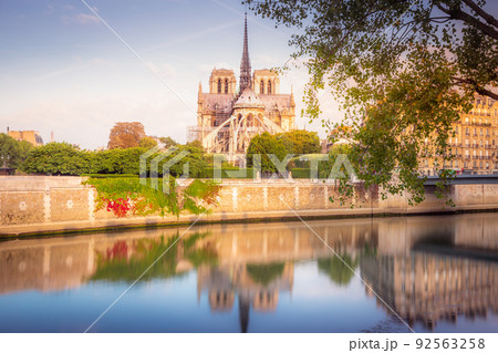 Notre Dame of Paris on Seine River reflection at sunrise, France Notre Dame of Paris on Seine River reflection at sunrise, France 92563258