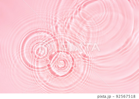 Abstract cosmetic background, pink water texture with round ripples, close up 92567518