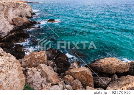 Coastal landscape with rocks and azure shore water Coastal landscape with rocks and azure shore water 92570910