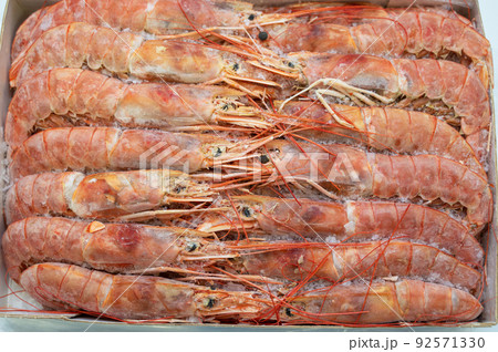 Frozen shrimp in fridge at the fish market. Frozen shrimp in fridge at the fish market. 92571330