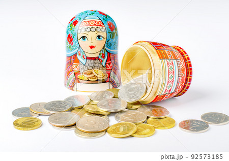 Traditional Russian toy matryoshka and money. White background. Copy space Traditional Russian toy matryoshka and money. White background. Copy space 92573185