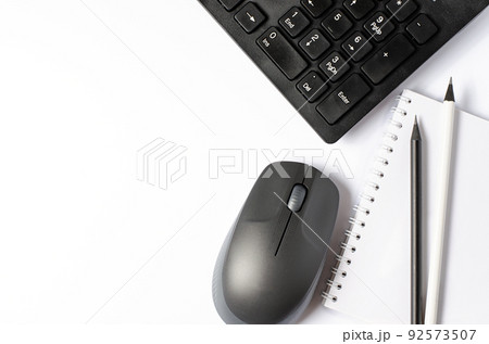 Computer mouse and keyboard on a white background. Copy space 92573507