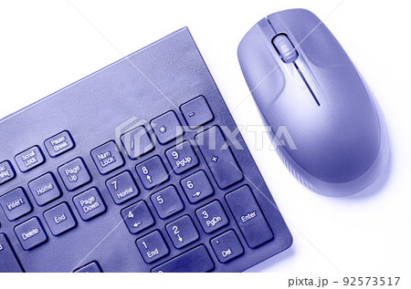 The computer mouse and keyboard are purple. The trending color of 2022. 92573517