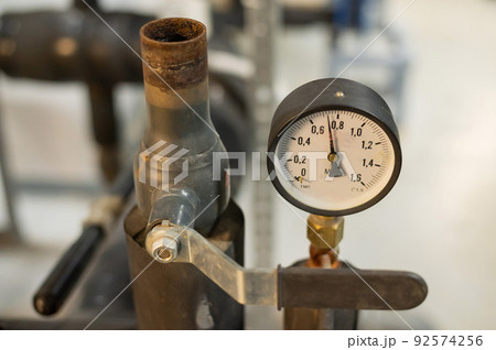 Pressure sensors in the urban heating system. Hot water pipes in an industrial boiler room. Pressure sensors in the urban heating system. Hot water pipes in an industrial boiler room. 92574256