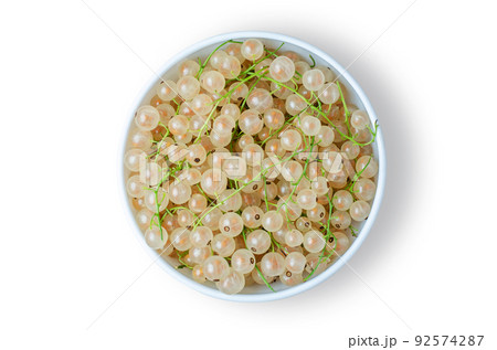 White currant. Ripe berries in a white plate. Isolated on white 92574287