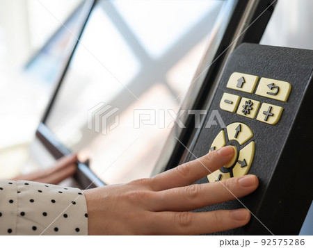 A woman uses a voting device for blind and visually impaired citizens.  92575286