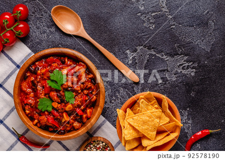 Chili Con Carne in bowl on dark background. Chili Con Carne in bowl on dark background. 92578190