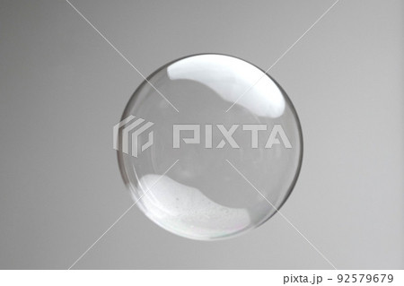 Flying soap bubbles on grey background. Abstract soap bubbles with reflections. Soap bubbles in motion background. 92579679