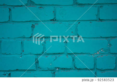 Brick wall close-up. The brick wall painted in blue. Place for text. Empty space 92583523