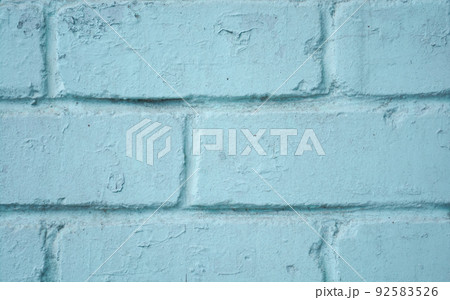 Brick wall close-up. The brick wall painted in blue. Place for text. Empty space Brick wall close-up. The brick wall painted in blue. Place for text. Empty space 92583526