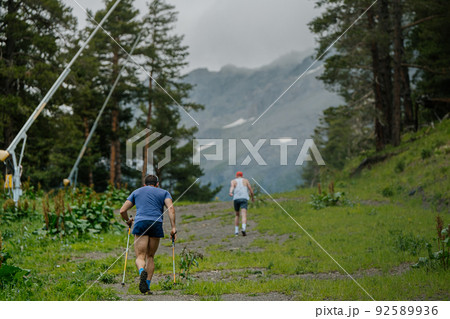 two male athletes go uphill during vertical kilometer 92589936