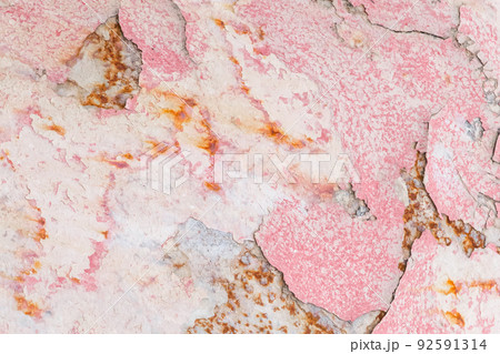 Old peeling weathered outdated paint pink abstract pattern wall texture background 92591314